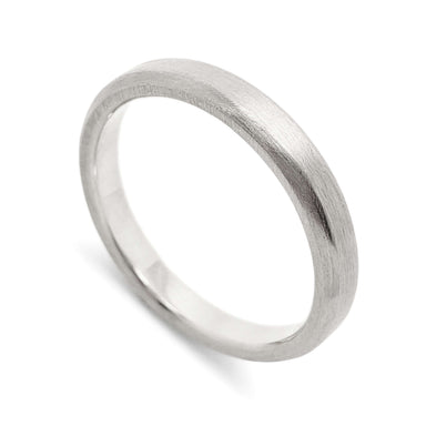 Handcrafted 14k white gold wedding ring with a flat profile and brushed finish