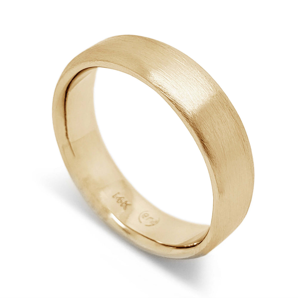 Handcrafted 14k yellow gold flat wedding ring with brushed finish on white background