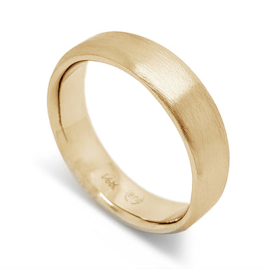Handcrafted 14k yellow gold flat wedding ring with brushed finish on white background