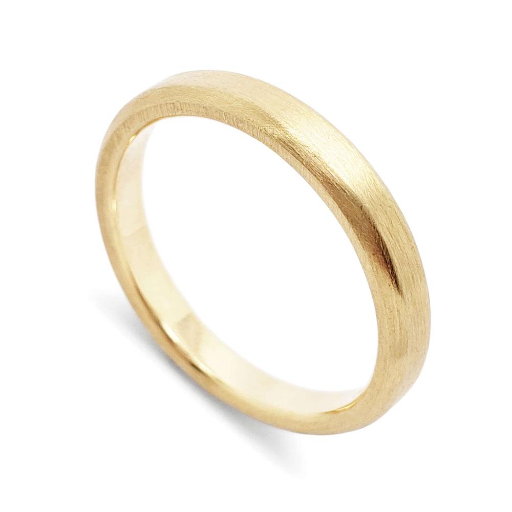 Handcrafted 14k yellow gold wedding ring with brushed finish and rolled edge
