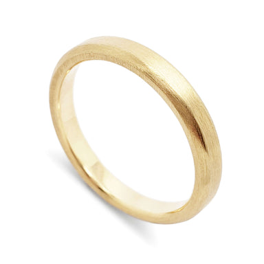 Handcrafted 14k yellow gold wedding ring with brushed finish and rolled edge