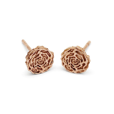 Pair of handcrafted 14kt rose gold floral rose stud earrings on white background