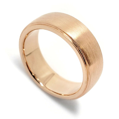 Handcrafted 14kt rose gold wedding band with lowered edges and brushed finish
