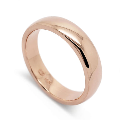Handcrafted 14kt rose gold wedding ring with a high polish and low dome profile