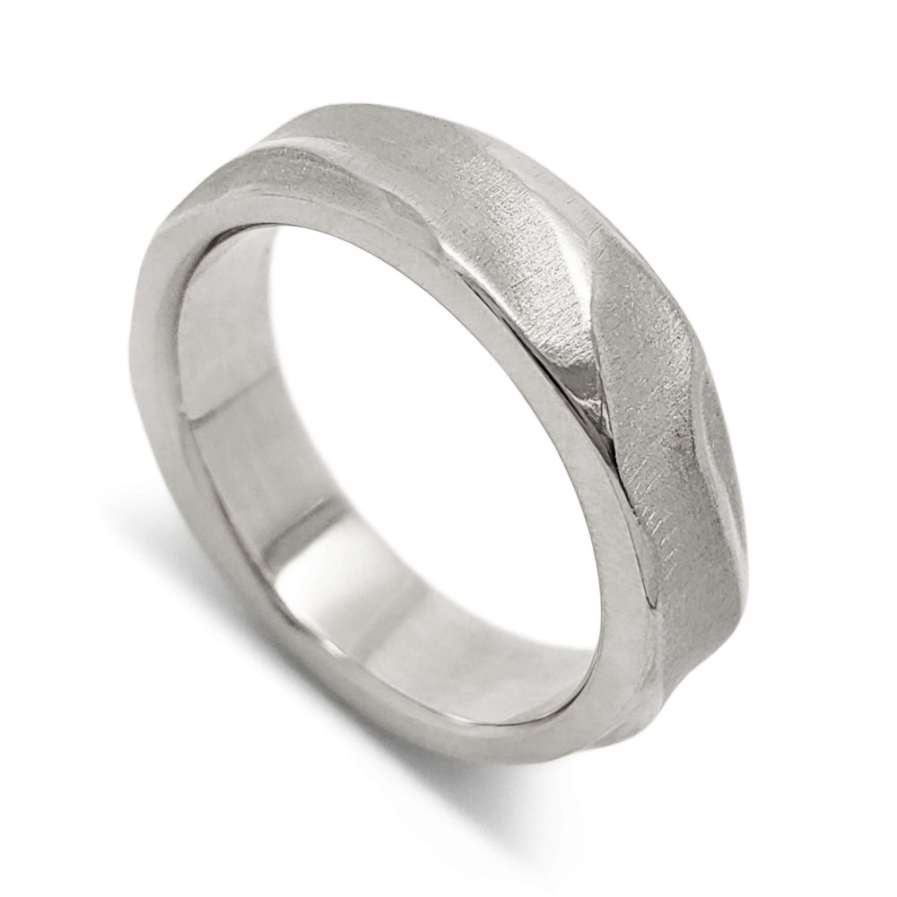 Handcrafted 14kt white gold wedding ring with topography texture, angled view