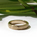 Handcrafted 14kt yellow gold wedding band with engraved Art Deco details in natural light