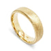 Handcrafted 14kt yellow gold flat wedding band with saw blade texture