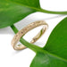 Handcrafted 14kt yellow gold wedding ring shown with engraved floral band on plant stem