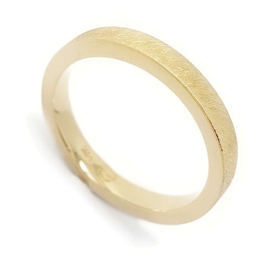 Handcrafted 14kt yellow gold wedding ring with saw blade texture and flat profile