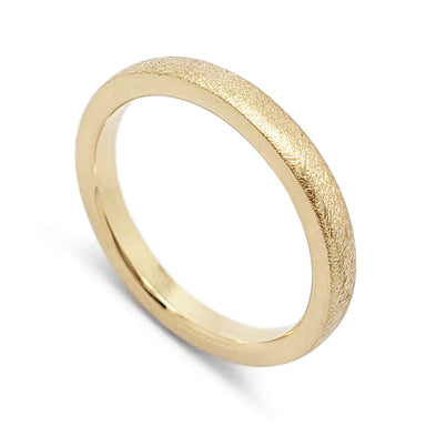 Handcrafted 14kt yellow gold wedding ring with saw blade texture finish