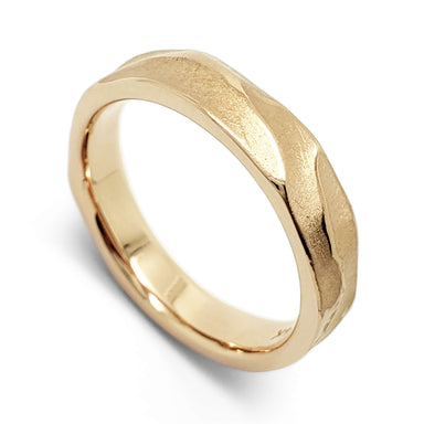 Handcrafted 14kt yellow gold wedding ring with topography texture, angled view