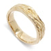 Handcrafted 14kt yellow gold wedding ring with woodgrain texture, angled view