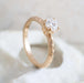 Handcrafted 14k yellow gold moissanite engagement ring with engraved wheat pattern