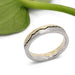 Handcrafted two-tone gold mountain range wedding ring by Era Design, angled view