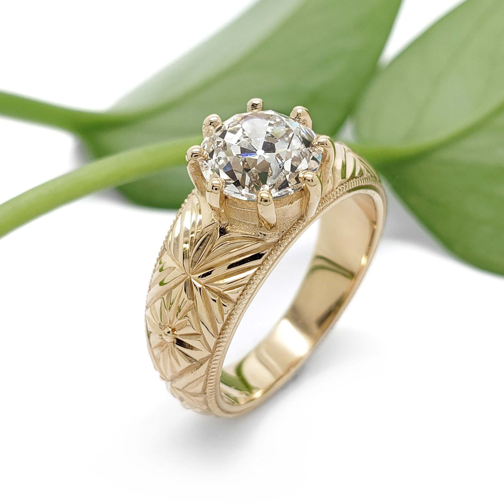 Handcrafted yellow gold engagement ring with engraved floral detail and lab diamond