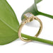 Handcrafted yellow gold engagement ring with radiant lab diamond and diamond shoulders, side view