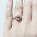 14kt yellow gold lab diamond cluster engagement ring shown on a hand