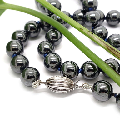 Hematite bead necklace with ribbed silver fish hook clasp detail