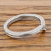 Inside view of 14k white gold chevron ring showing hallmark and millgrain edge