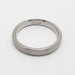 Inside view of 14k white gold wedding ring showing hallmark and brushed texture