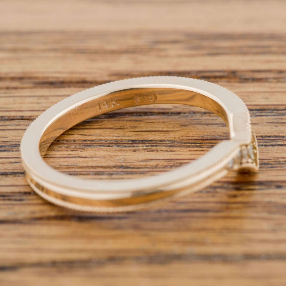 Interior engraving of 14k yellow gold chevron diamond ring with millgrain detail