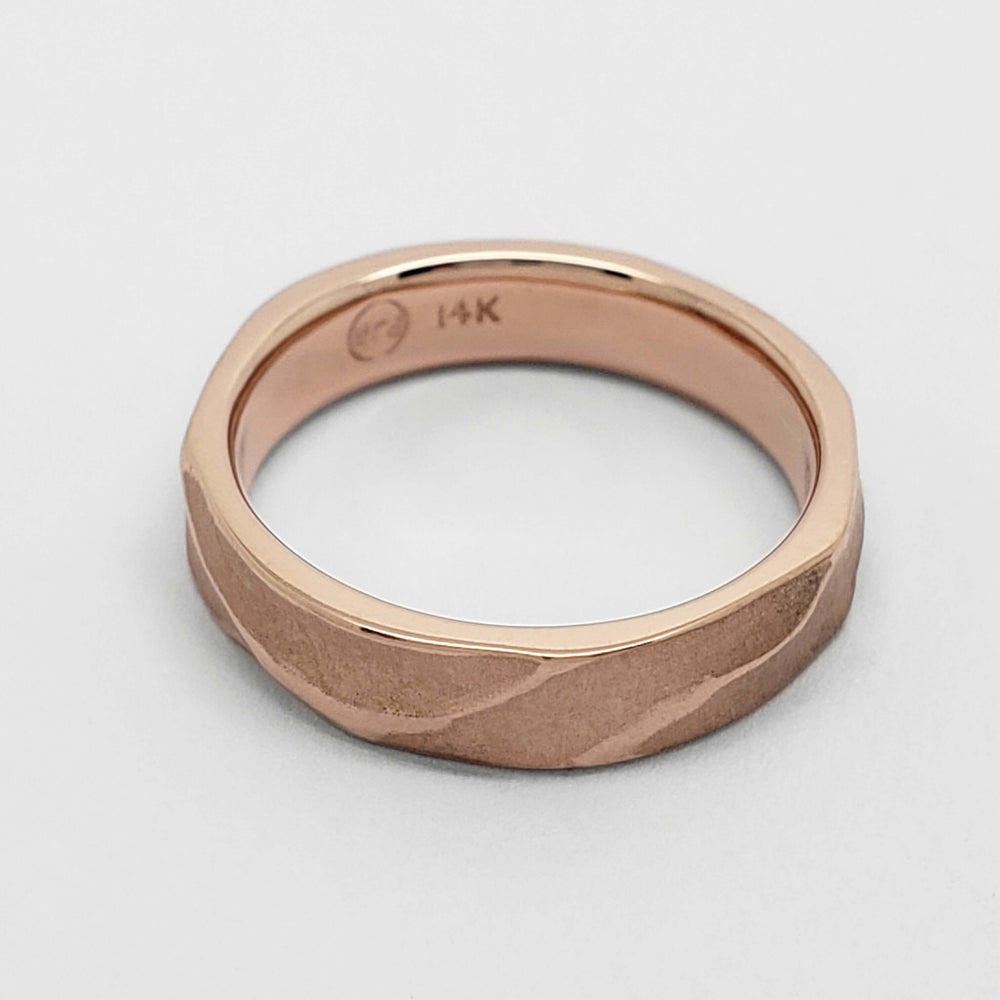Interior view of 14kt rose gold topography wedding ring showing hallmark