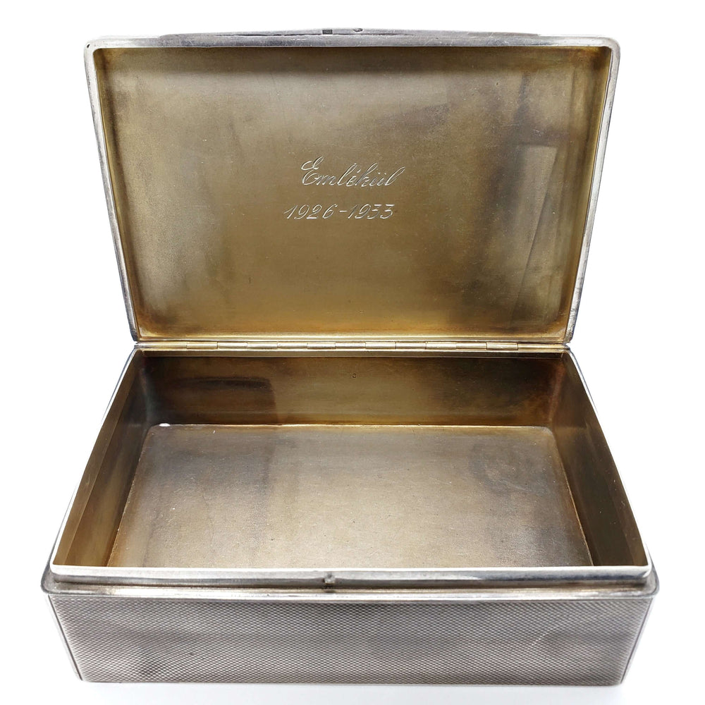 Open antique silver cigar box showing gold-washed interior and engraved inscription