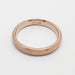 Interior view of 14k rose gold flat wedding ring showing hallmark and brushed finish