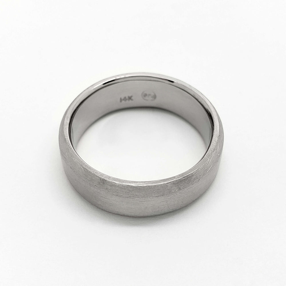 Interior view of 14k white gold flat wedding ring with brushed finish