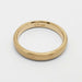 Interior view of 14k yellow gold wedding ring showing hallmark and brushed finish