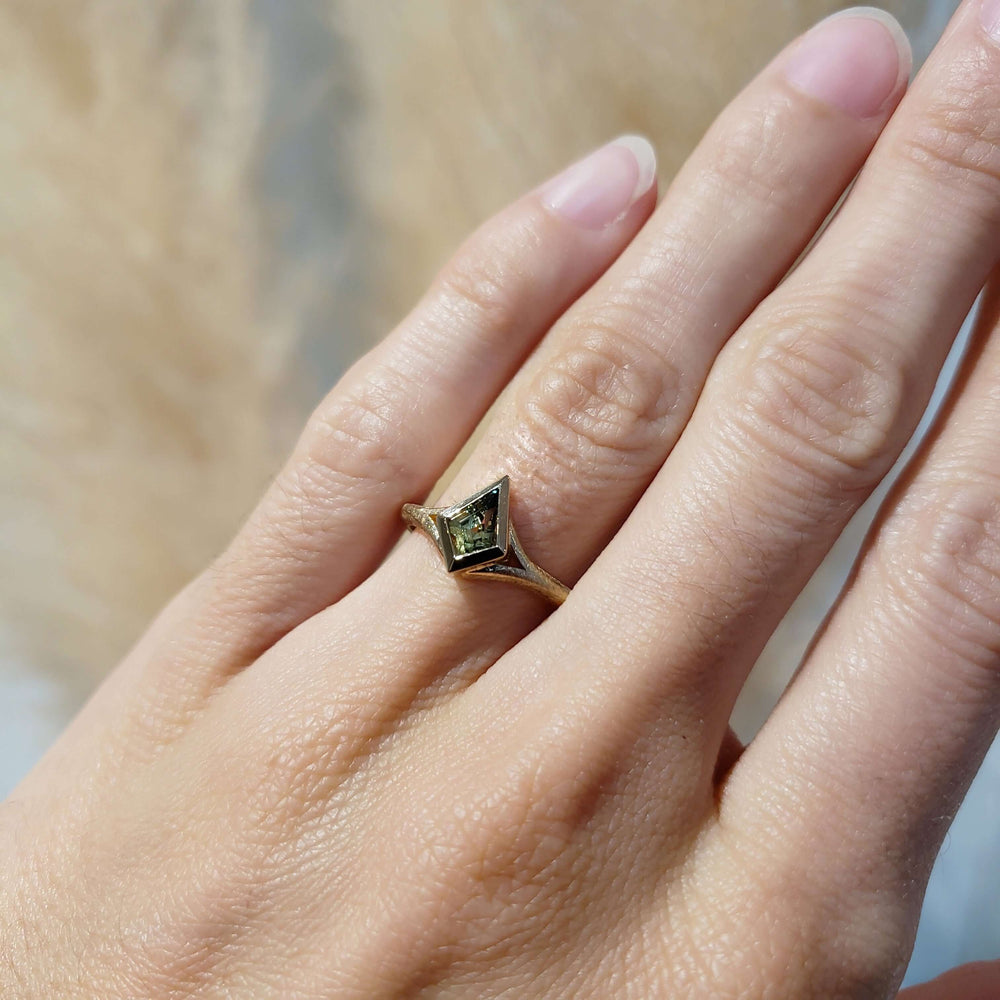 Kite-shaped Australian sapphire ring in 14kt yellow gold shown on hand