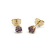 Pair of lab-grown alexandrite stud earrings in 14k yellow gold with four-claw settings