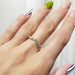 Lab diamond chevron ring in yellow gold worn on a hand