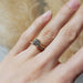 Lab diamond yellow gold wedding ring stacked with engagement ring on hand