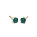 Pair of lab emerald stud earrings in 14kt yellow gold on a white background