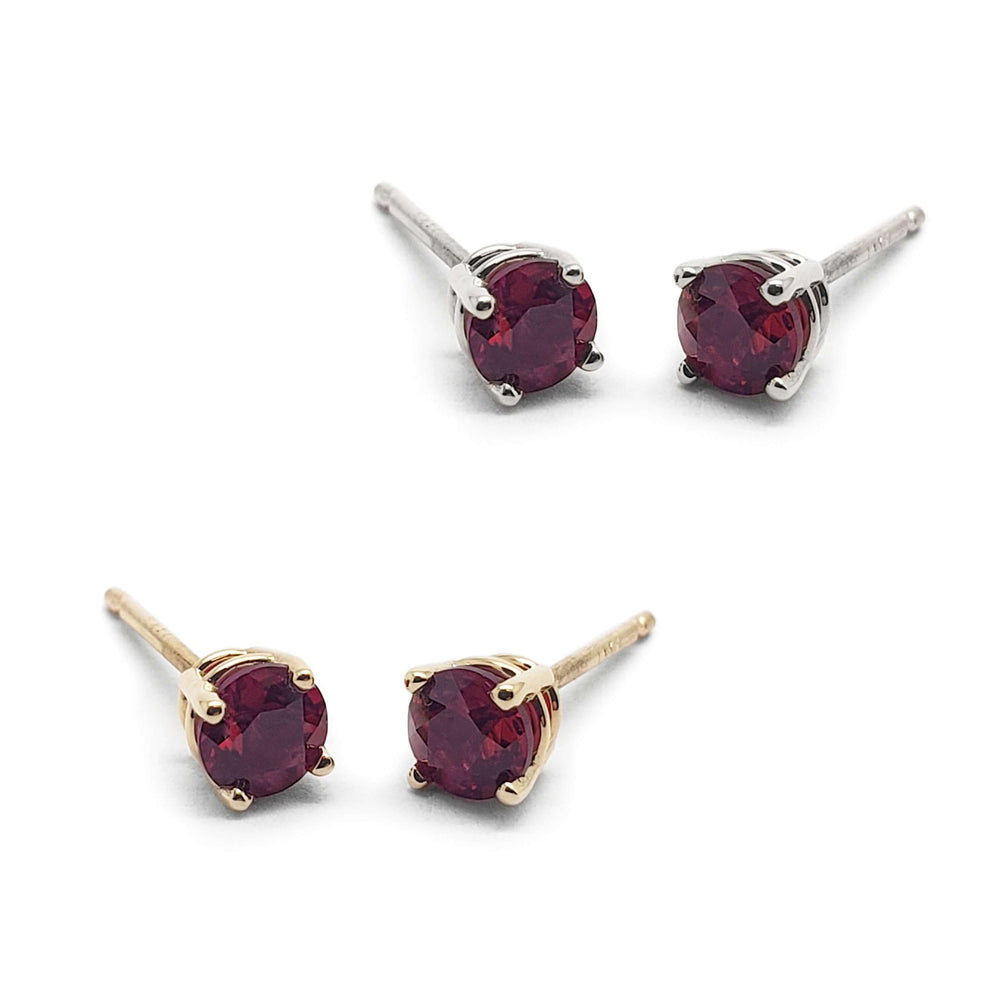 Two pairs of round lab grown ruby stud earrings in 14kt white and yellow gold, 4-claw setting