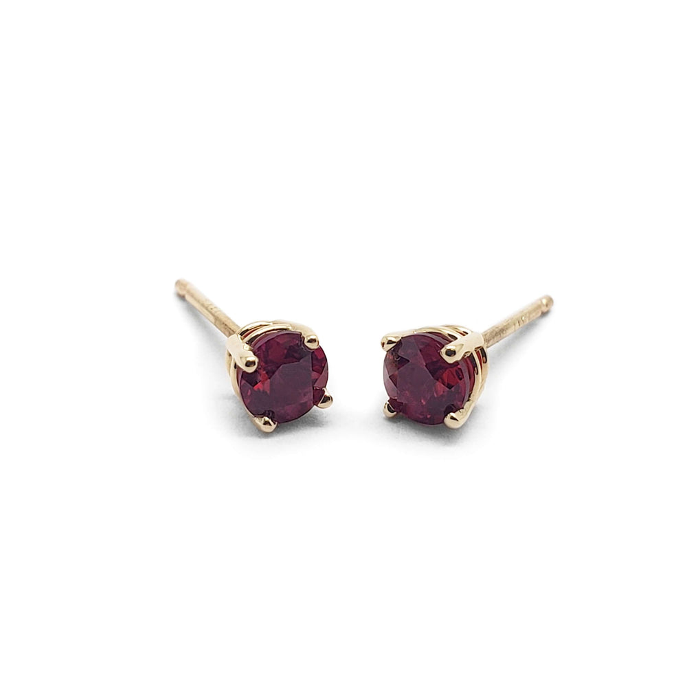 Pair of round lab grown ruby stud earrings in 14kt yellow gold, 4-claw setting