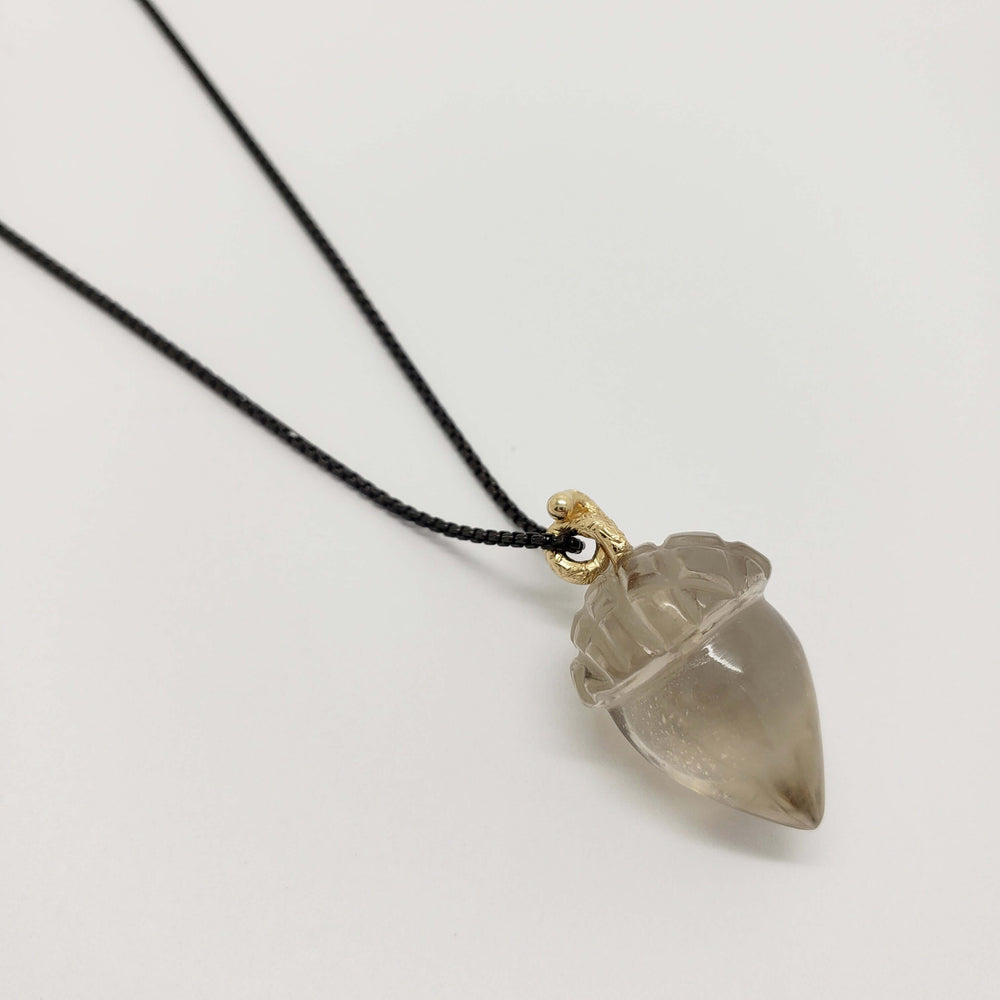 Large smoky quartz acorn pendant with 14kt yellow gold bail on blackened chain