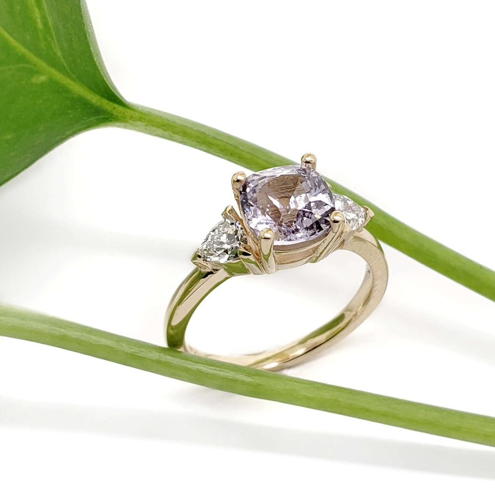 Lavender sapphire and lab diamond engagement ring in yellow gold with plant accent