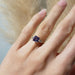 Lavender sapphire and lab diamond yellow gold ring shown on hand