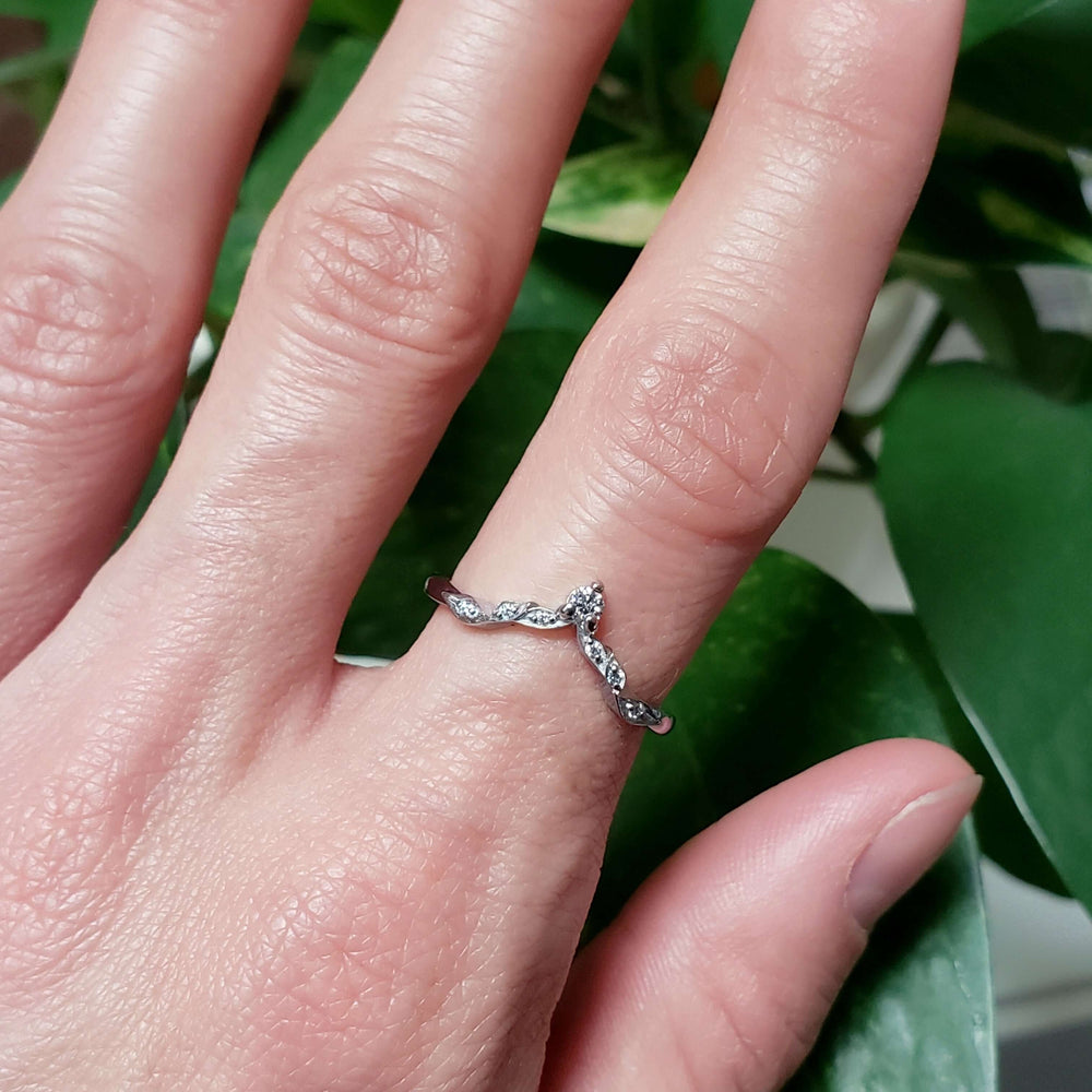 Leaf-inspired 14k white gold diamond wedding ring worn on hand