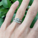 Leafy diamond wedding band stacked with vintage-inspired diamond engagement ring
