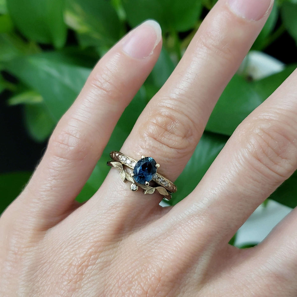 Leafy rose gold wedding band with diamond stacked with blue sapphire and diamond rings