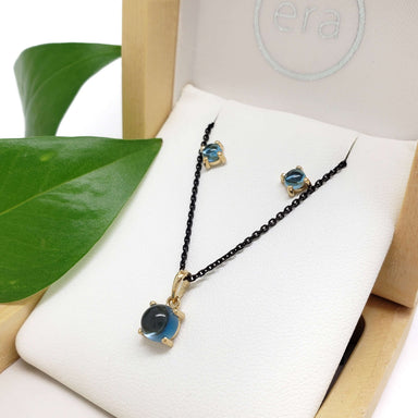 London blue topaz pendant and earrings set in 14kt yellow gold, displayed in Era Design box