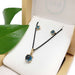 London blue topaz pendant and earrings set in 14kt yellow gold, displayed in Era Design box