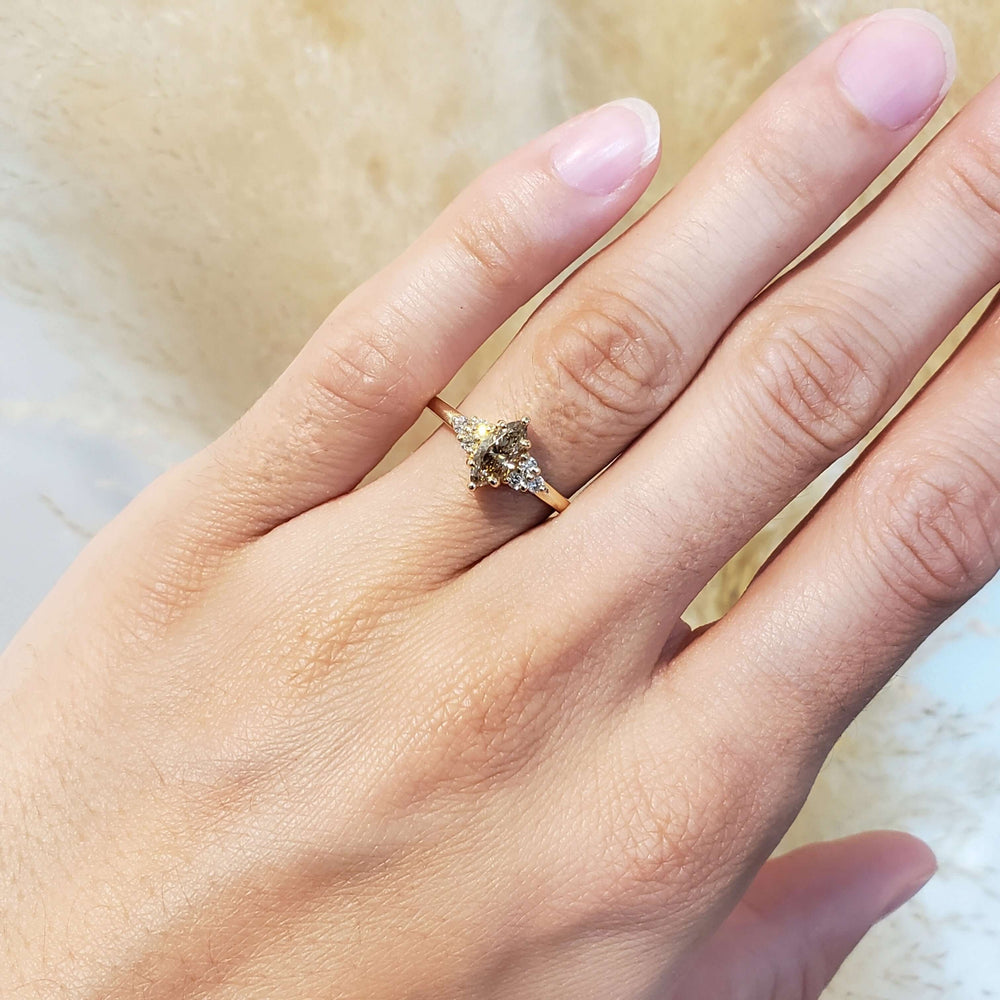 Marquise champagne diamond ring in yellow gold shown on hand