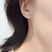 Marquise diamond bezel stud earring in 14kt yellow gold worn on ear