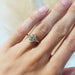 Marquise lab diamond engagement ring in yellow gold shown on hand