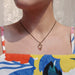 Medium smoky quartz acorn pendant with 14kt gold bail shown on a woman's neck