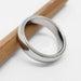 Millgrain edge 14kt white gold wedding ring on white background with pencil